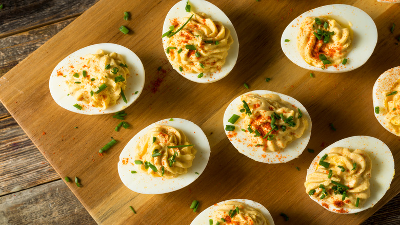 A chopping board of deviled eggs