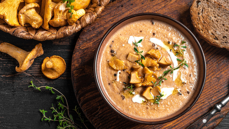 Mushroom soup bowl on a wooden board