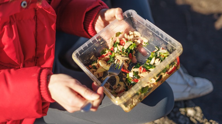 Camper eating homemade salad