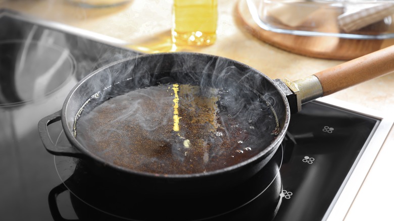 oil smoking in pan on stove