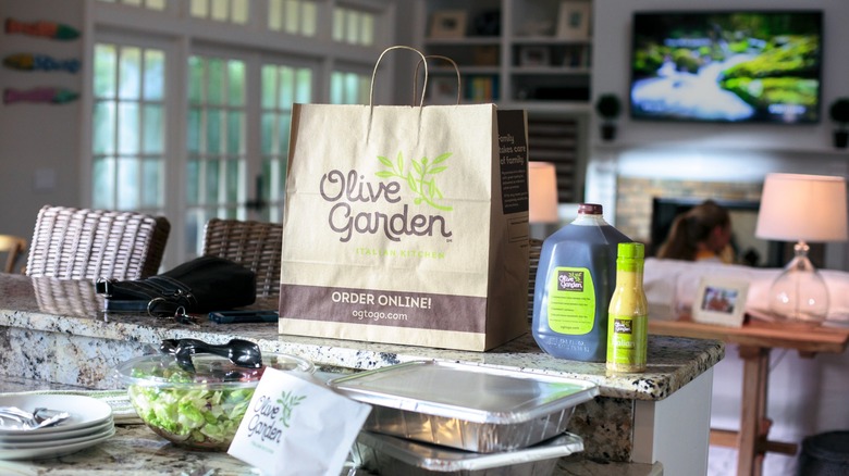 An image of an Olive Garden delivery order spread out in a home kitchen