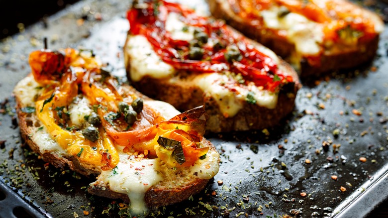 Open sandwich with melted cheese and roasted peppers