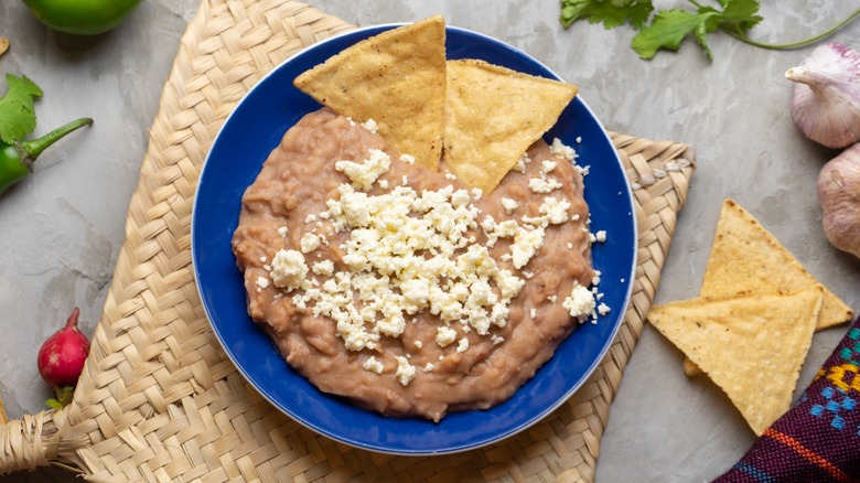 refried beans on blue plate