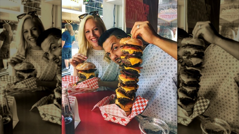 Two Heart Attack Grill customers in gowns