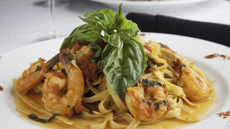 Shrimp fra diavolo sits on a white plate