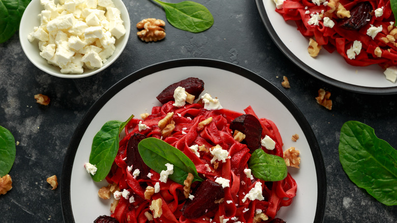 Beetroot pasta salad with goat cheese and walnuts