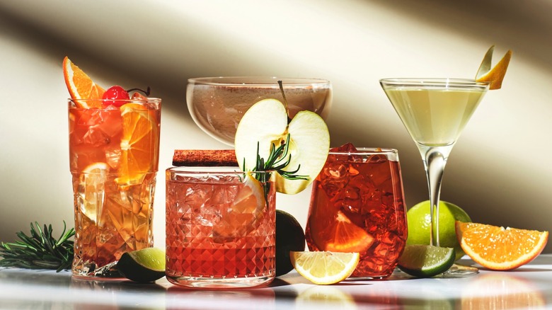 Various fruity cocktails with fruit garnishes