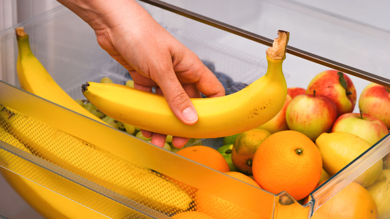 Taking bananas out of fridge crisper
