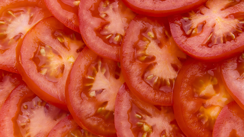 many sliced tomatoes in pile