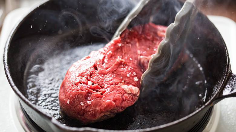 cooking steak in cast iron skillet
