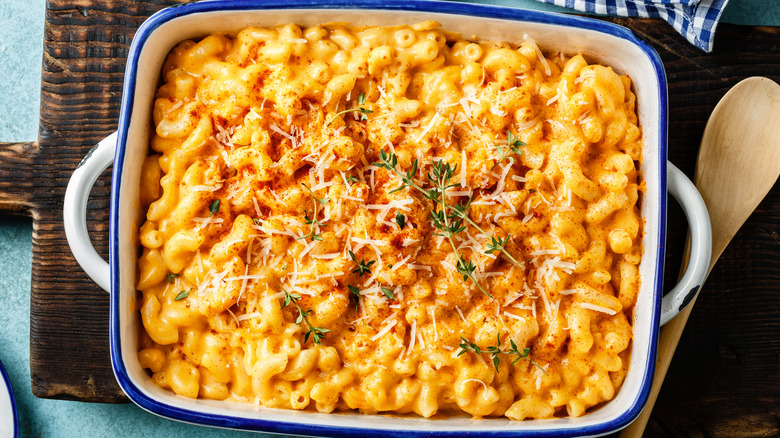 Mac and cheese in casserole with cheese, herbs, and parika