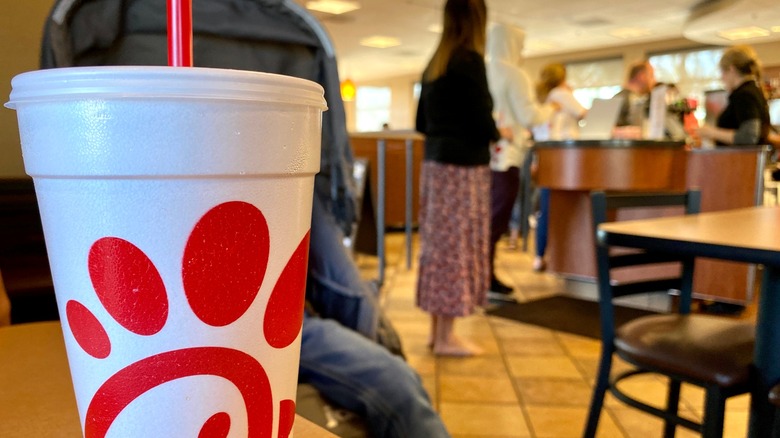 Chick-fil-A beverage in restaurant with customers