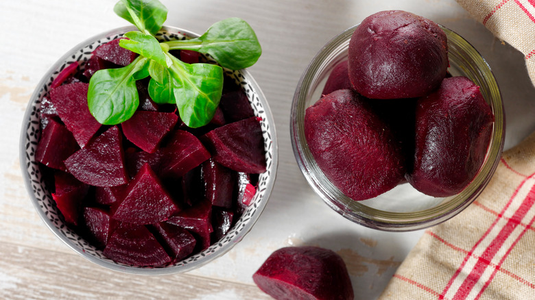 two containers filled with peeled beets