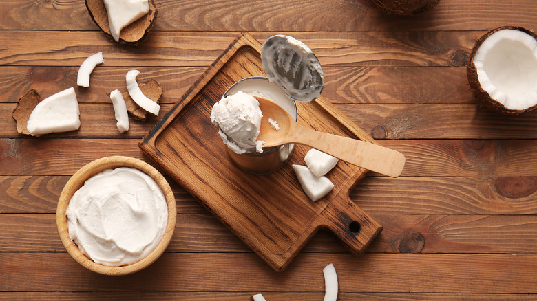 scooping coconut cream from can