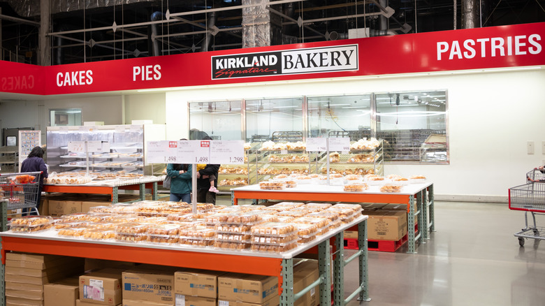 A Costco bakery section with browsing shoppers