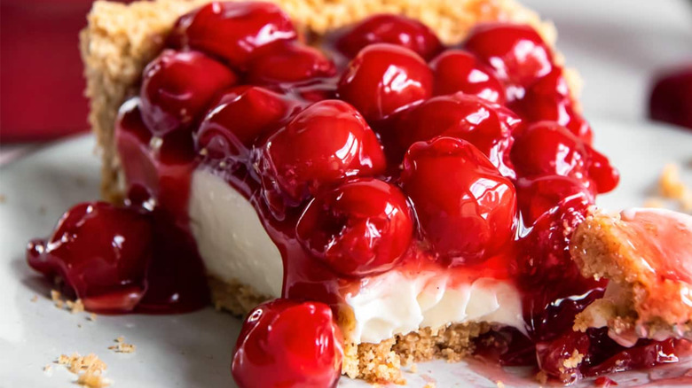 A slice of cream cheese cherry pie