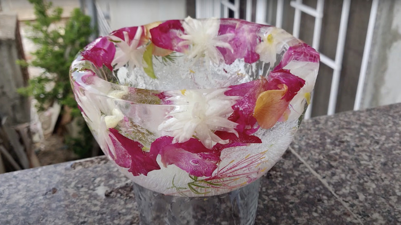 Ice bowl with flowers frozen inside of it