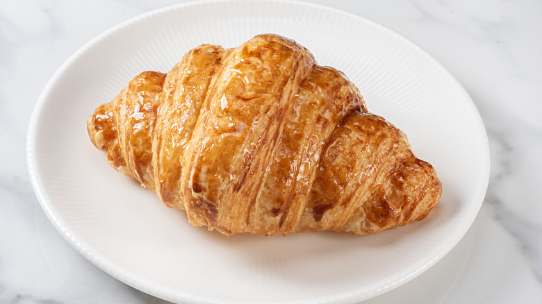 Croissant on white plate