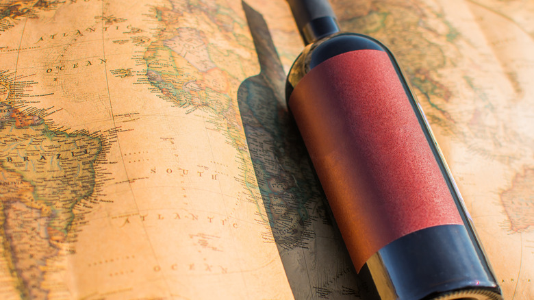 bottle of wine on a world map