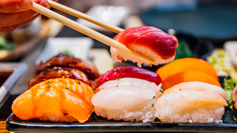 Colorful nigiri with chopstick