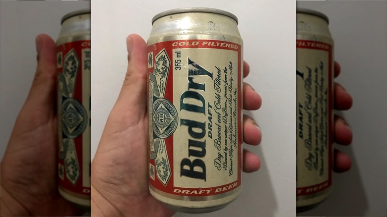 hand holding bud dry can