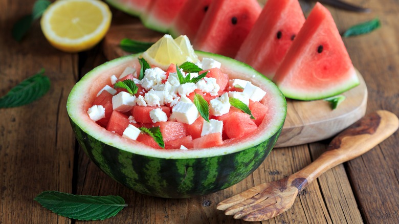 Watermelon salad served in rind bowl