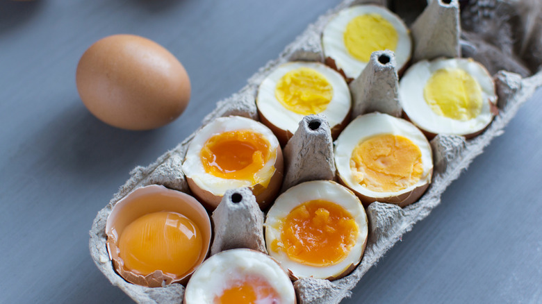 cooked egg halves in varying degrees of doneness