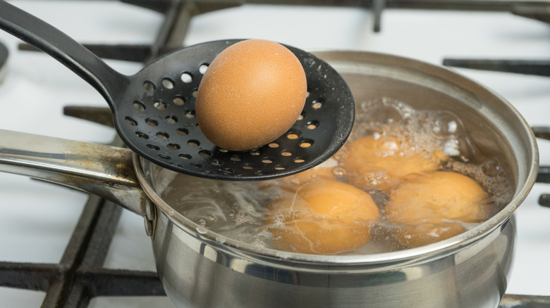 eggs boiling in a pot of water