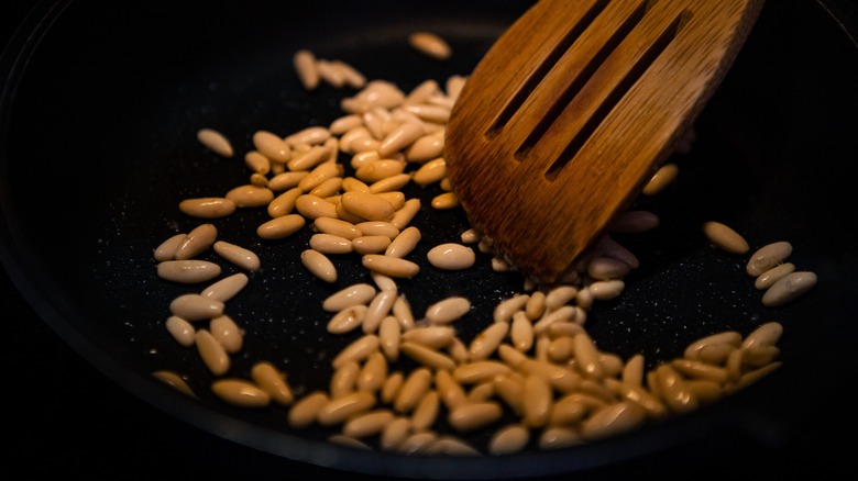 Roasting pine nuts in a skillet