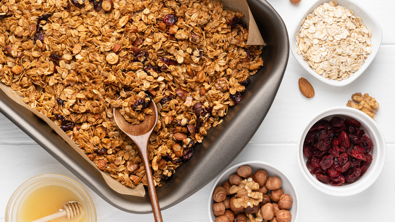 tray of granola surrounded by ingredients