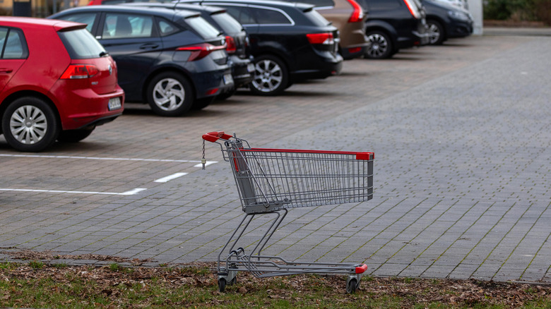 lone shopping cart in parking lot