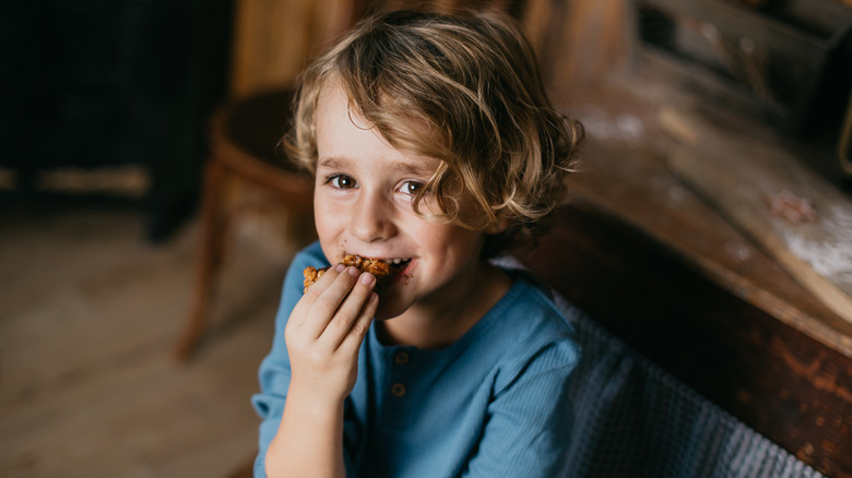 child eating a cookie