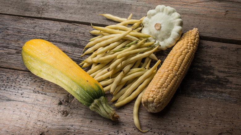 Corn, squash, and beans rustic background