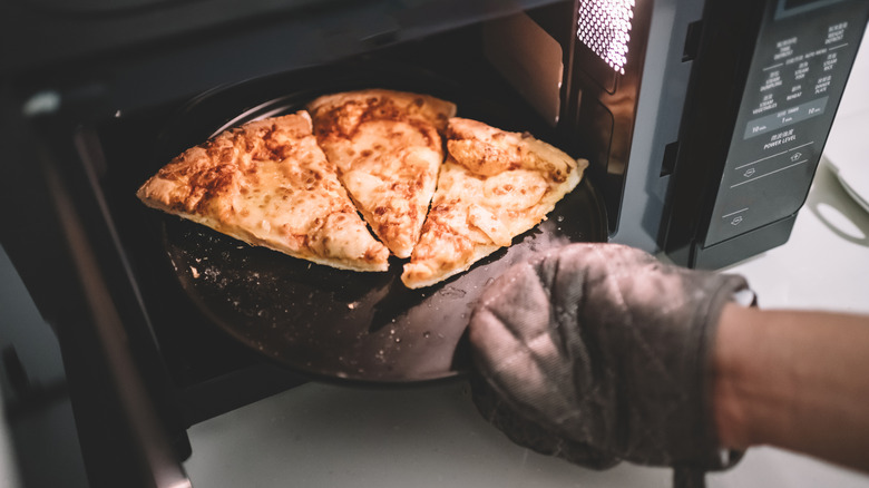 Microwaved pizza with melted cheese and crispy crust