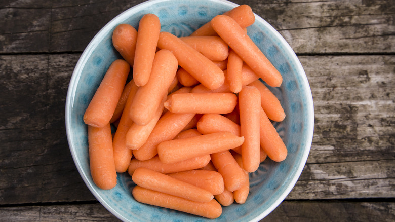 a bowl of baby carrots