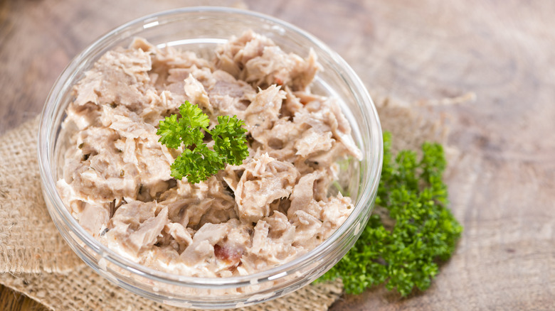 Plain chunk tuna salad in a bowl with parsley