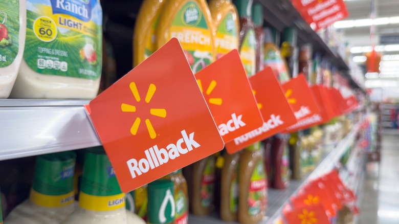 Walmart Rollback tags line a grocery shelf