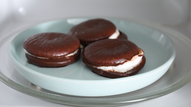 Choco pies with melted marshmallows in a microwave