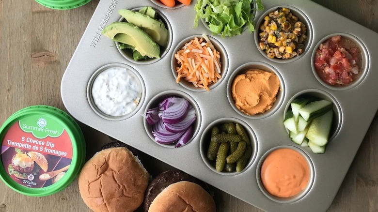 Muffin tray burger bar with condiments