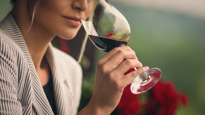Woman smelling wine