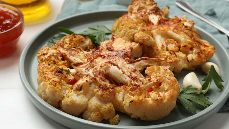 baked cauliflower steaks on a plate