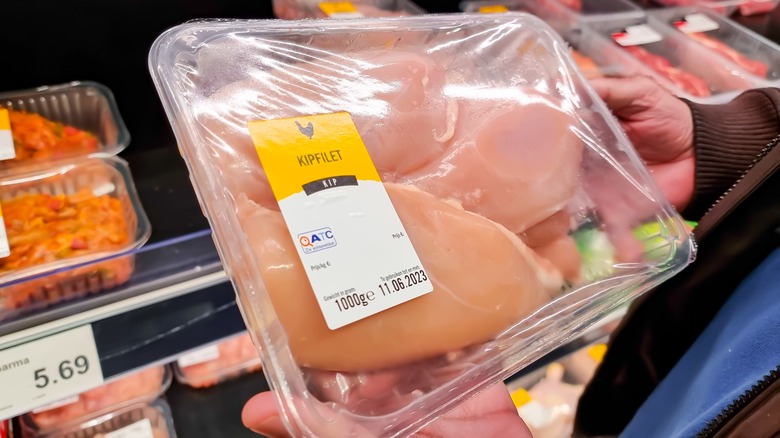 Aldi's packaged chicken in hands