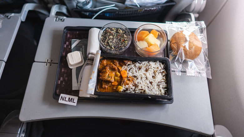 tray of food on airplane tray table