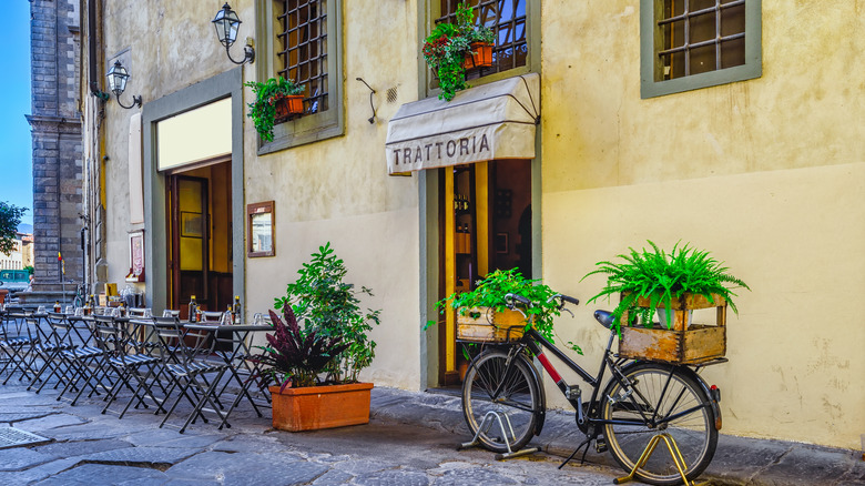 Outdoor Italian trattoria with tables