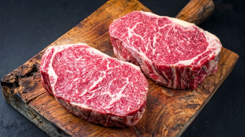 Raw steaks with fat trimmed