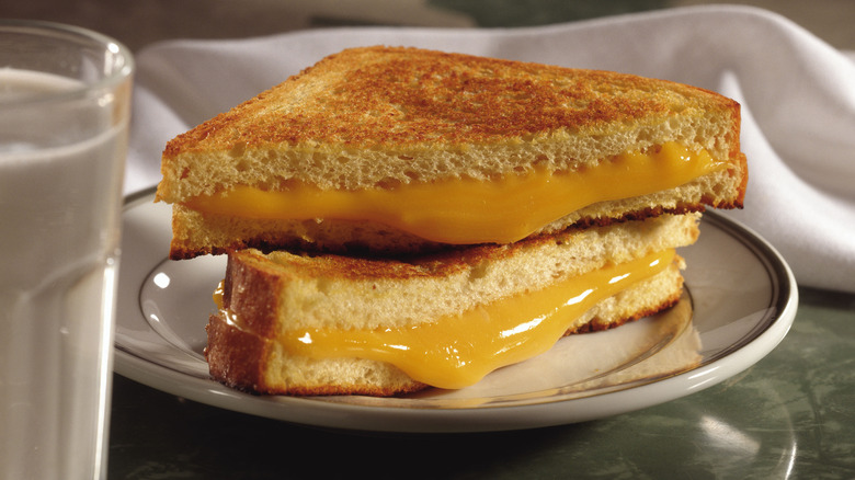 cheese dripping out of grilled cheese sandwich