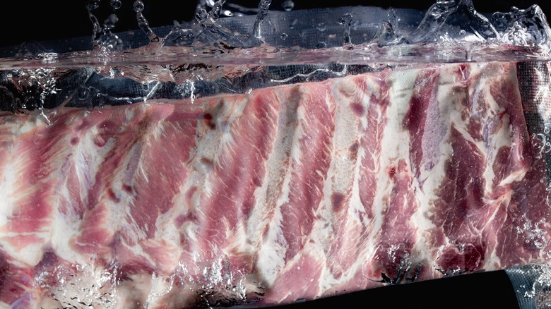 Vacuum sealed ribs submerged in water