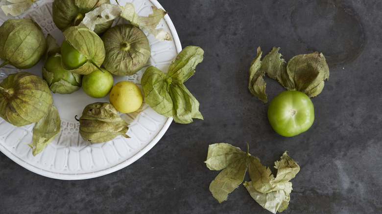 Ripe and raw tomatillos with husk