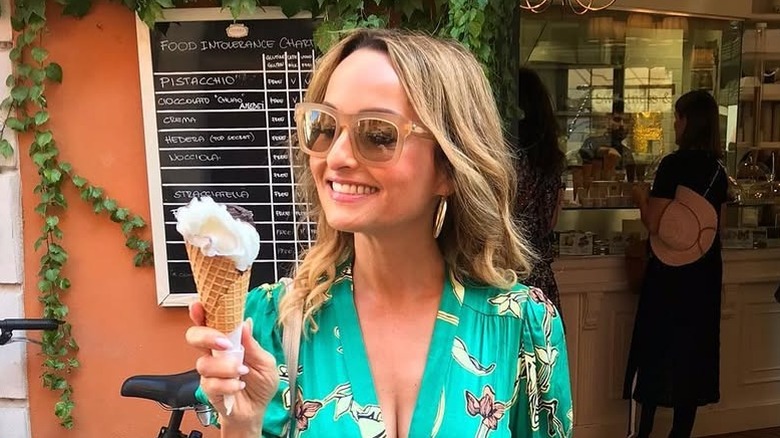 Giada De Laurentiis in a green dress holding an ice cream