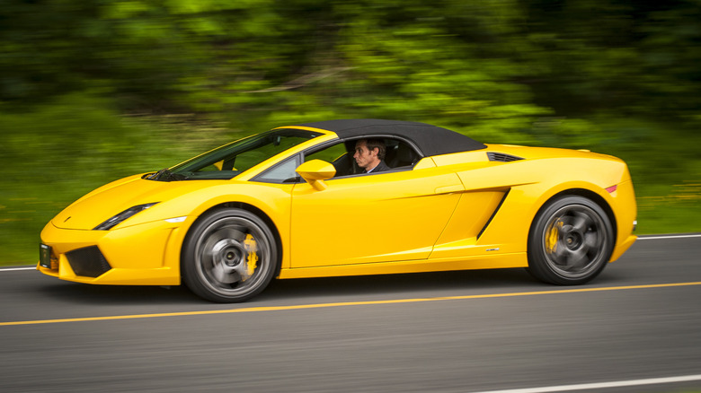 A yellow 2008 Lamborghini Gallardo convertible on the road